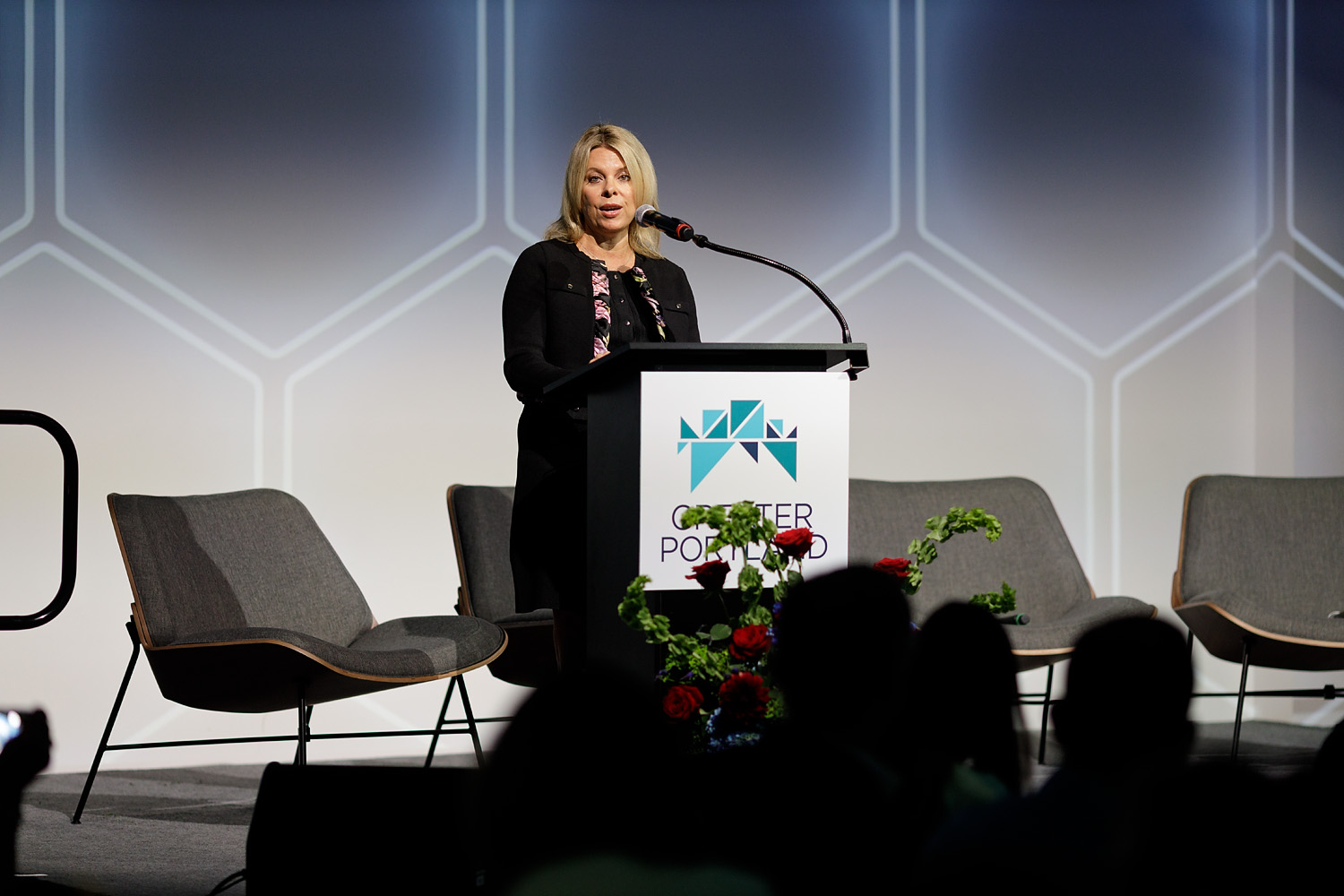 Kimm Lauterbach, President & CEO of REDI Cincinnati speaking on stage at GPI's 2026 Economic Summit